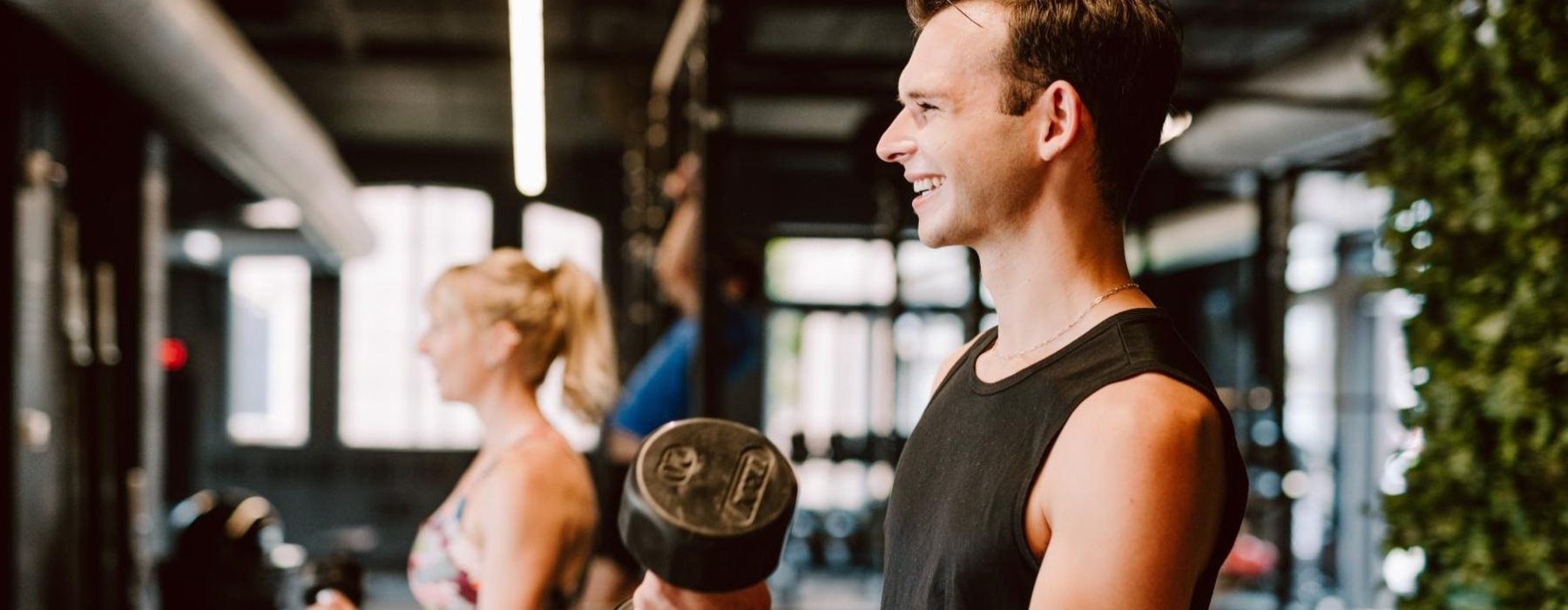 a couple working out with free weights